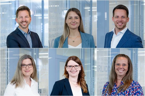 Sechs Personen in Businesskleidung